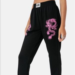 Adika ‘Tokyo Sweatpants’ in black with pink dragon